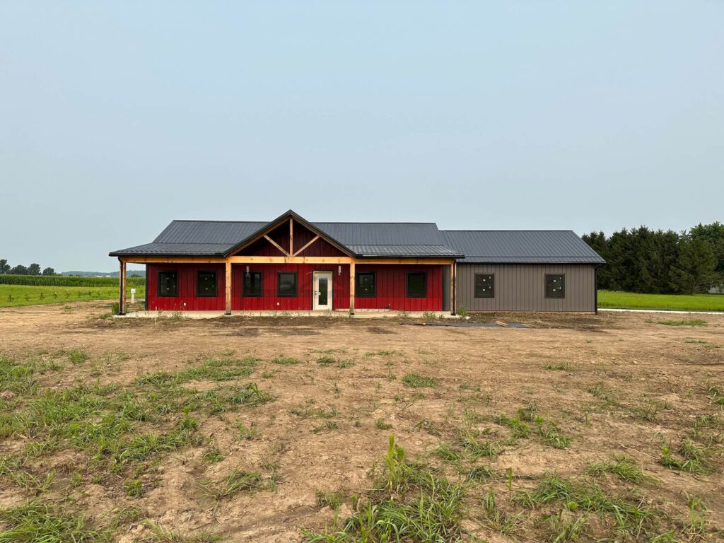 Pole barn with metal roofing and red siding