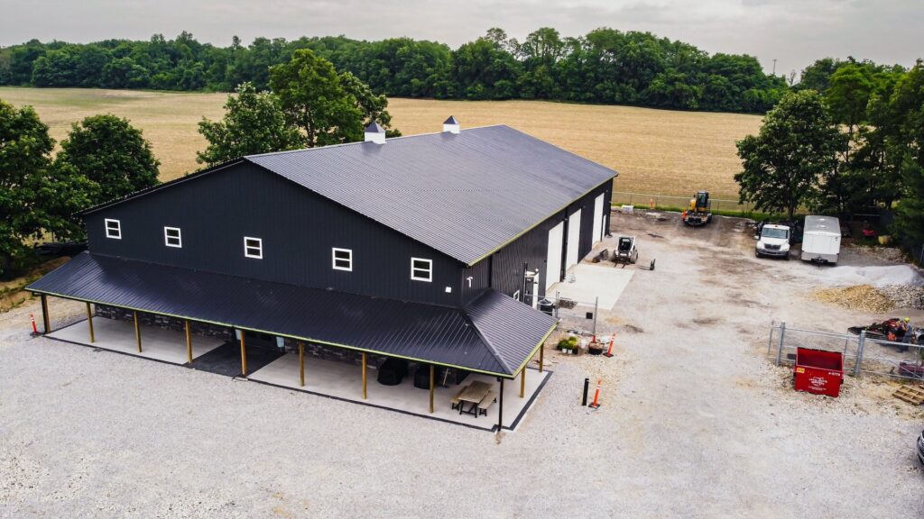 aerial view of a black commercial pole barn
