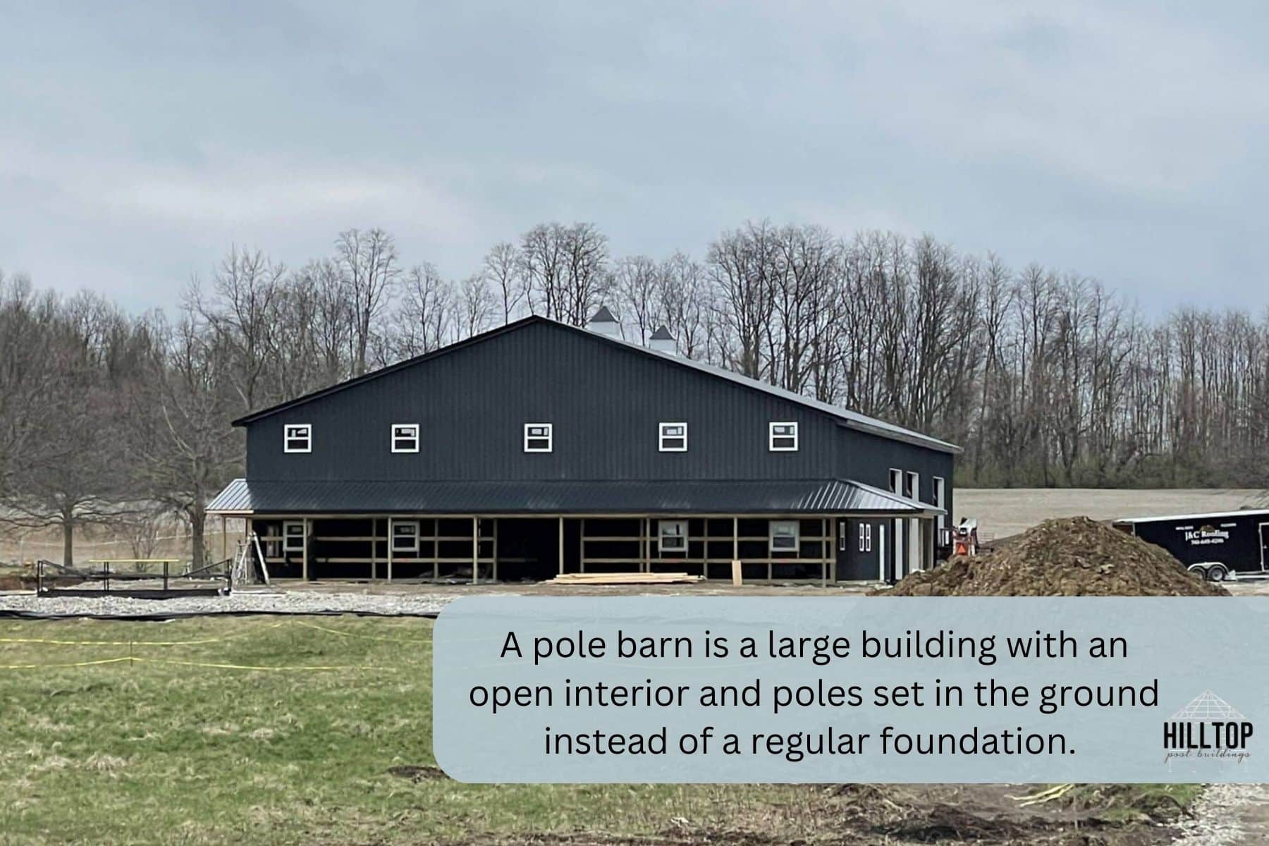 pole barn is a large building with an open interior and poles set in the ground instead of a regular foundation